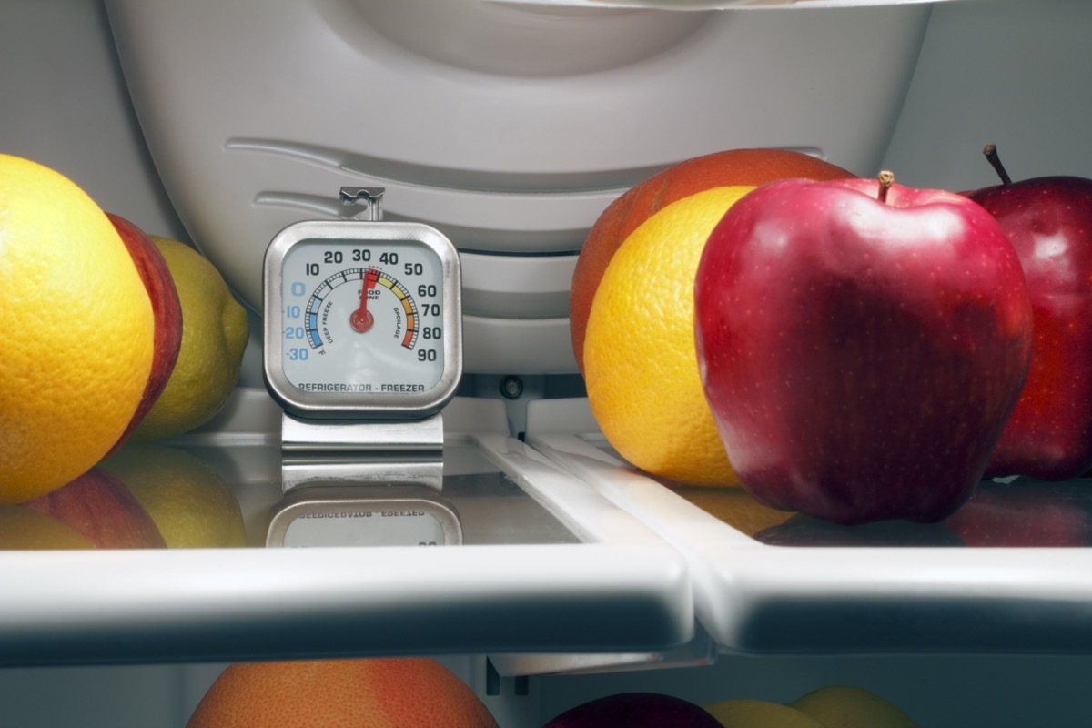 Refrigerator thermometer inside the top shelf of a cool food storage fridge to make sure perishables are kept safe and cold enough.