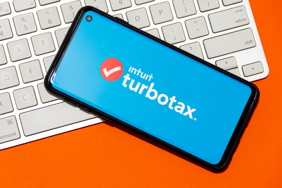 TurboTax on phone with a keyboard in the background