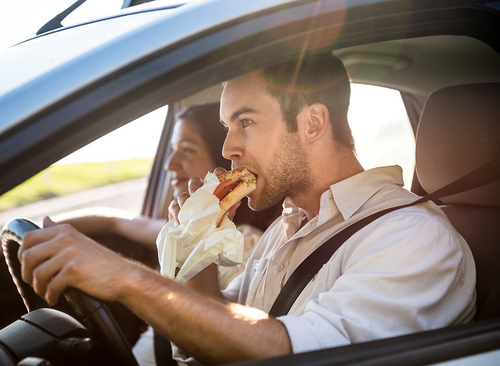 Man eating in car