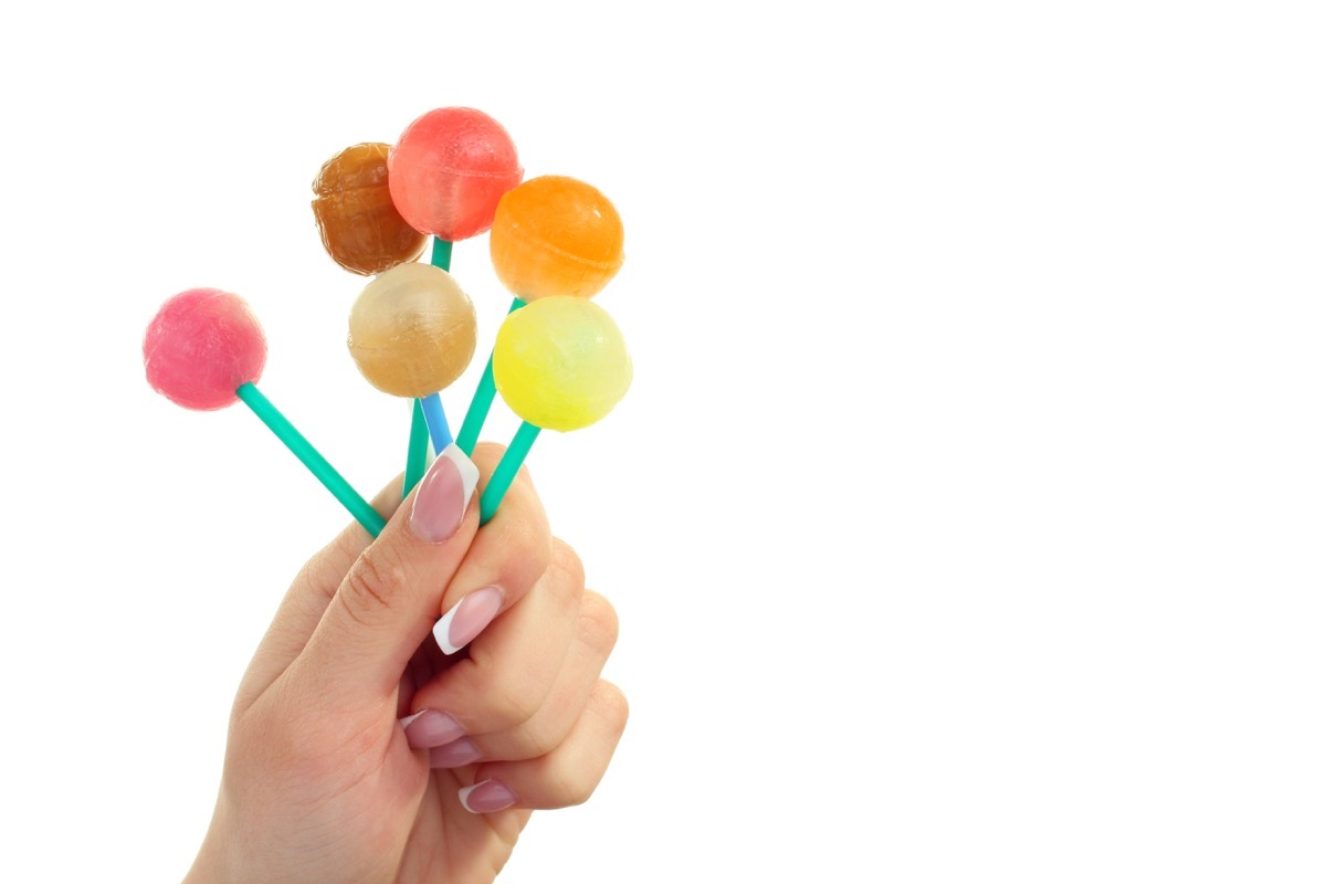 Woman holding lollipops