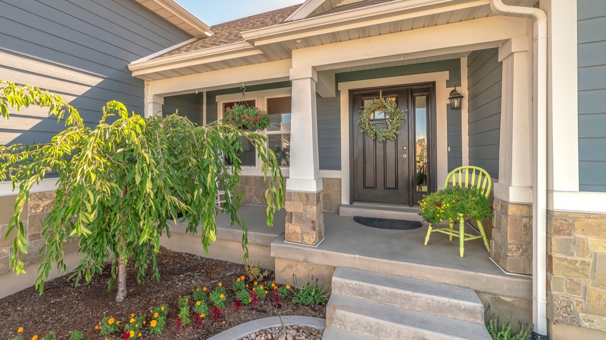 front porch with wreath and plants