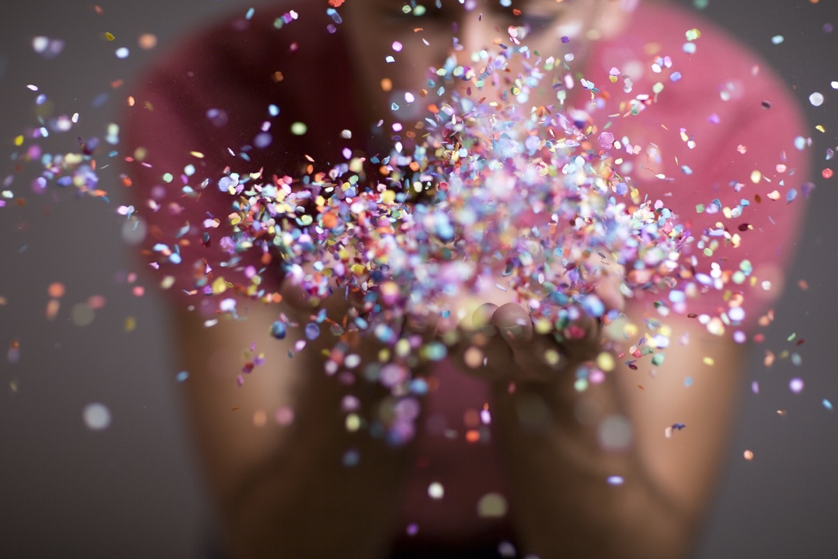 Person throwing confetti