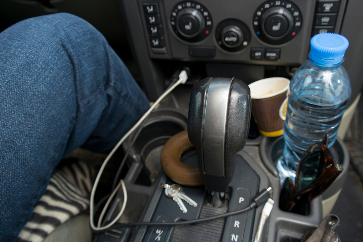 A driver leg and mess around his seat, concept of people untidiness