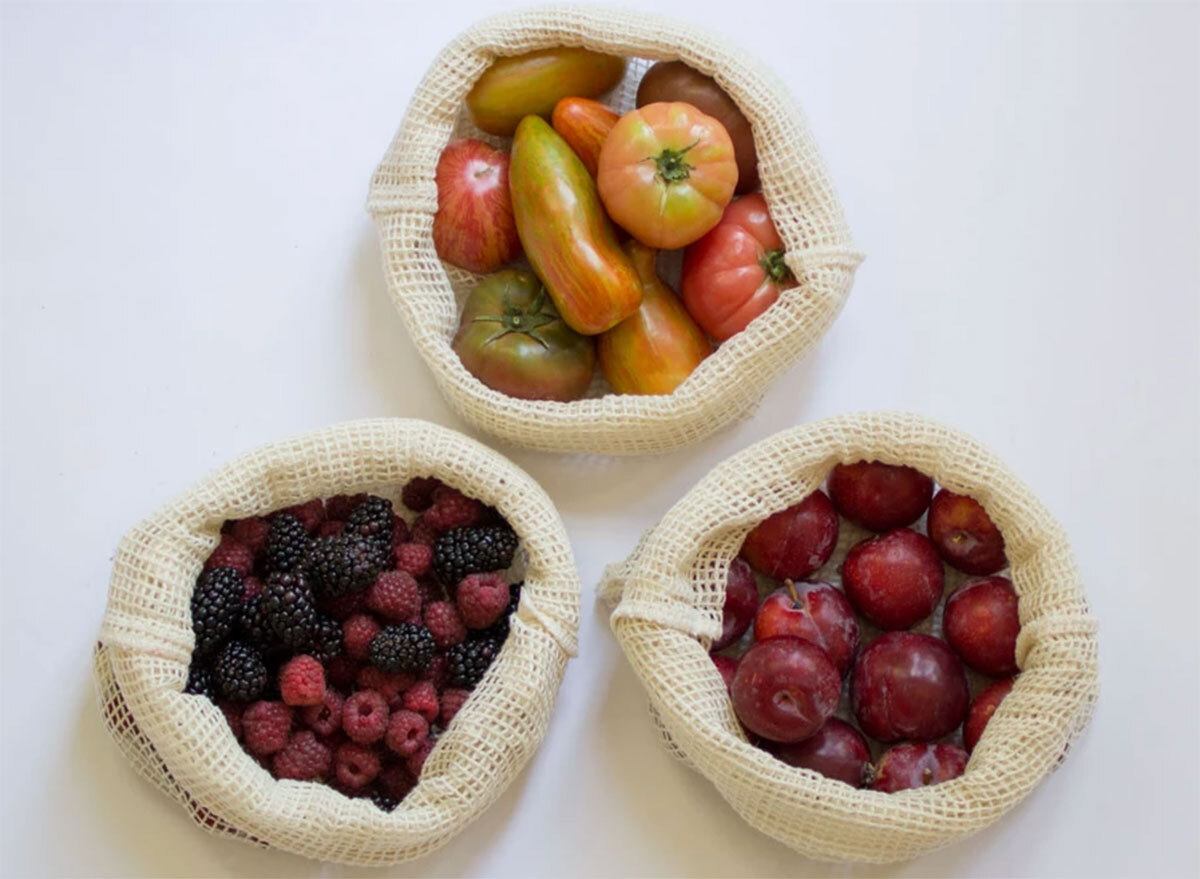 cotton mesh produce bags filled with tomatoes plums and berries