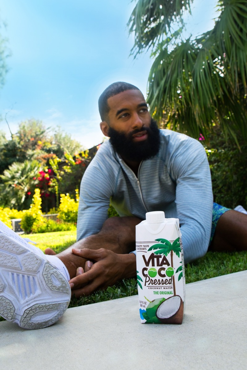 matt james stretching with vita coco in the foreground