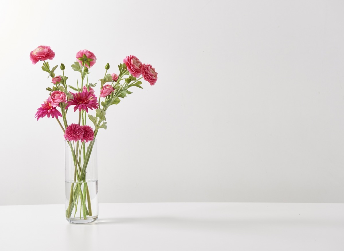 flower vase on a plain white table, getting rid of junk