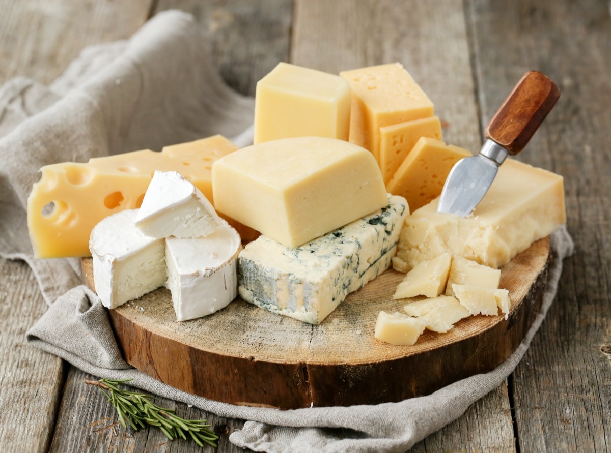 assorted cheeses on table