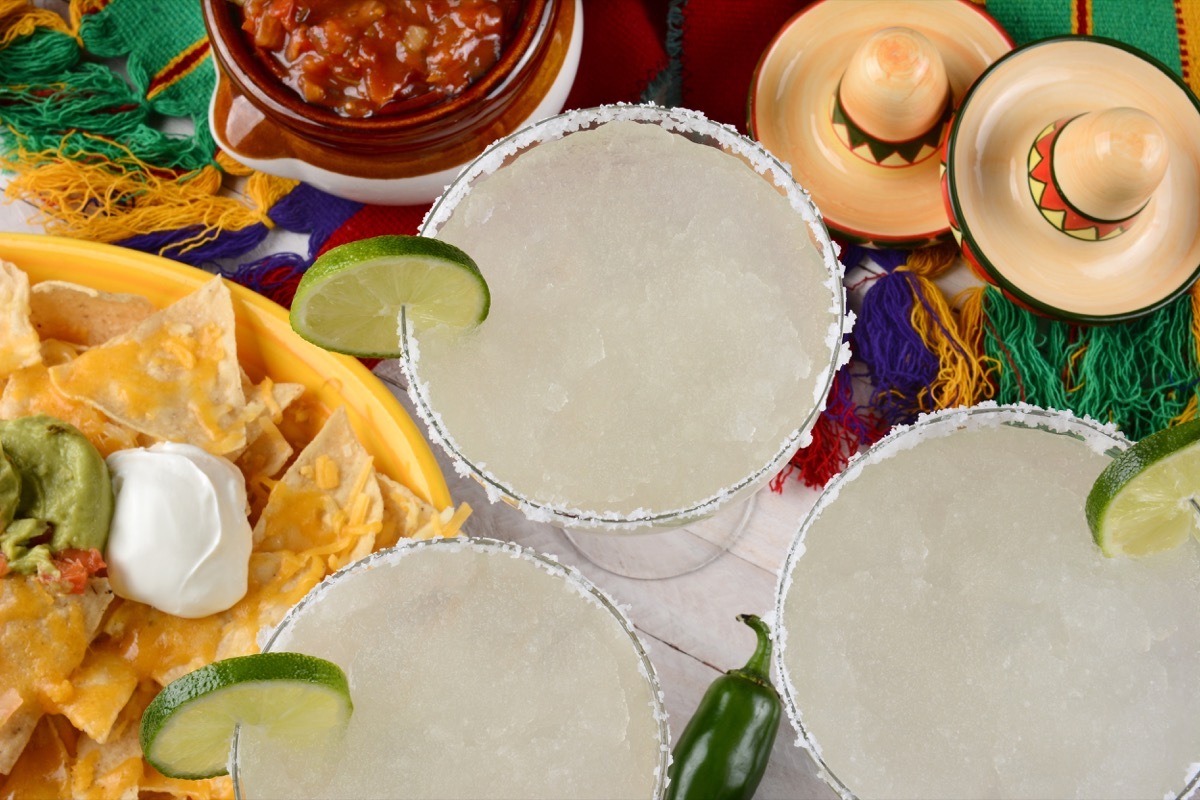 margarita cocktail, salt on glass rim, chips and salsa