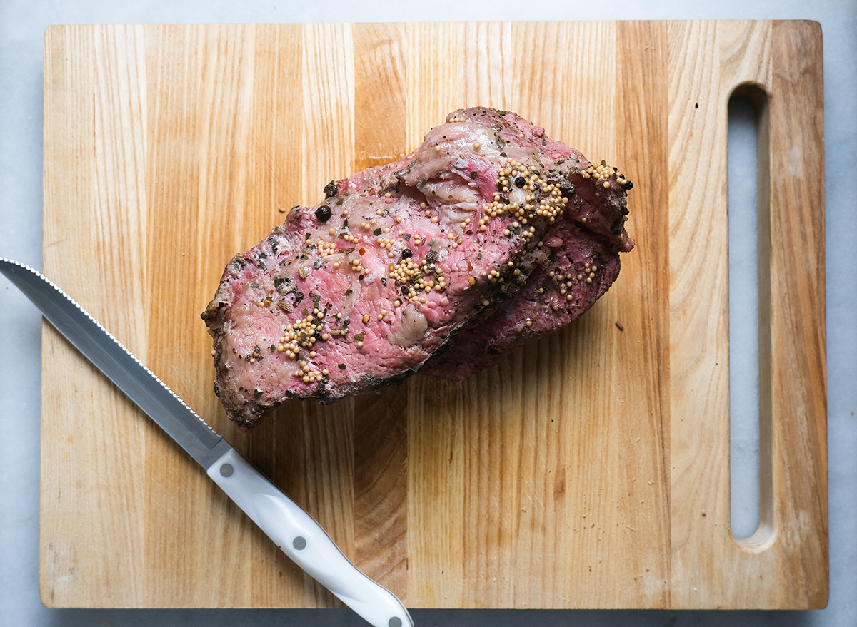 cooked corned beef on a cutting board