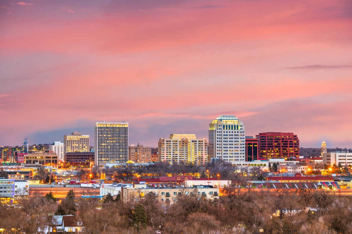 cityscape photos of buildings and tress in Colorado Springs, Colorado at sunset