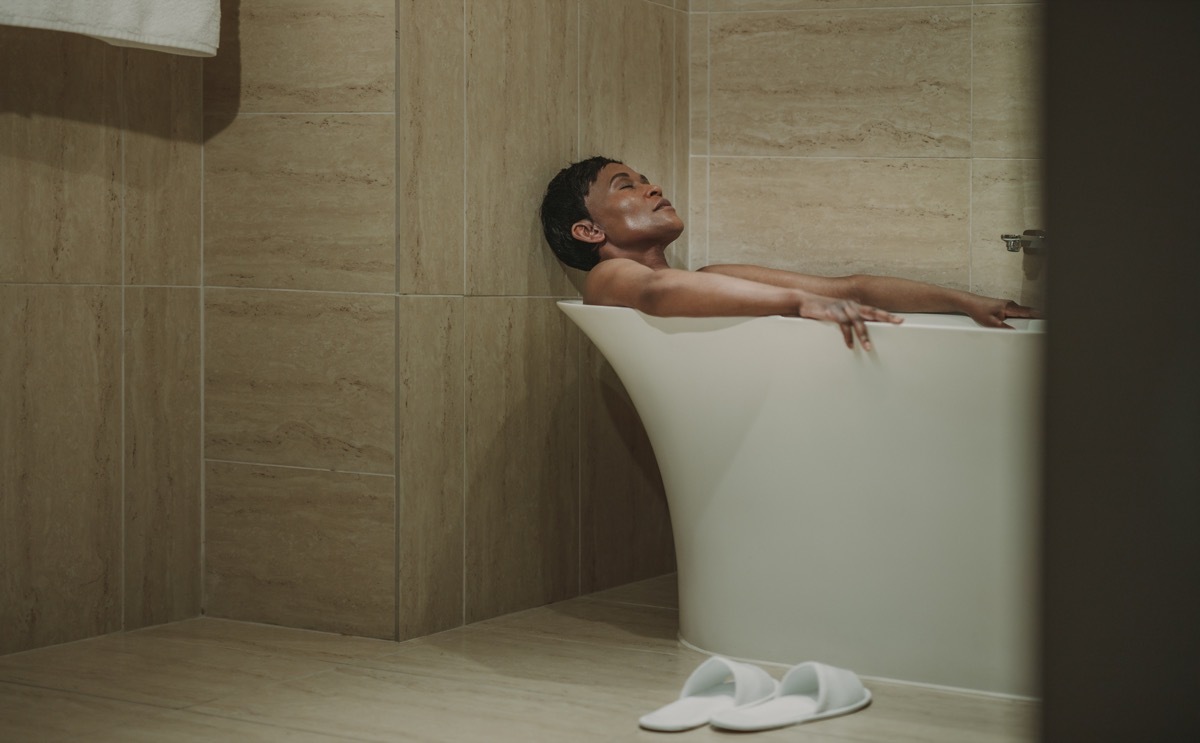 woman relaxing in the bath tub, over 40 fitness