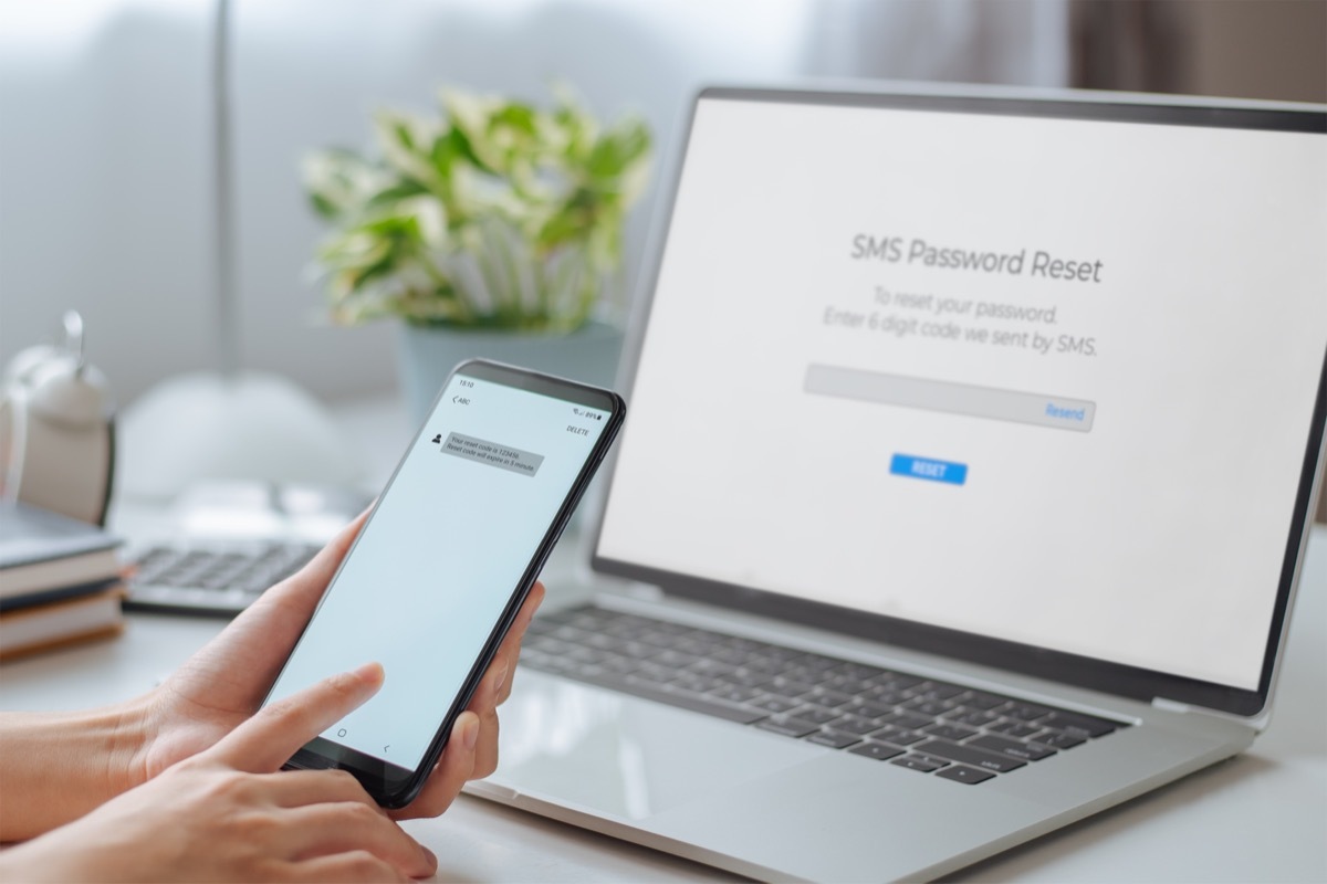person resetting password on phone and computer