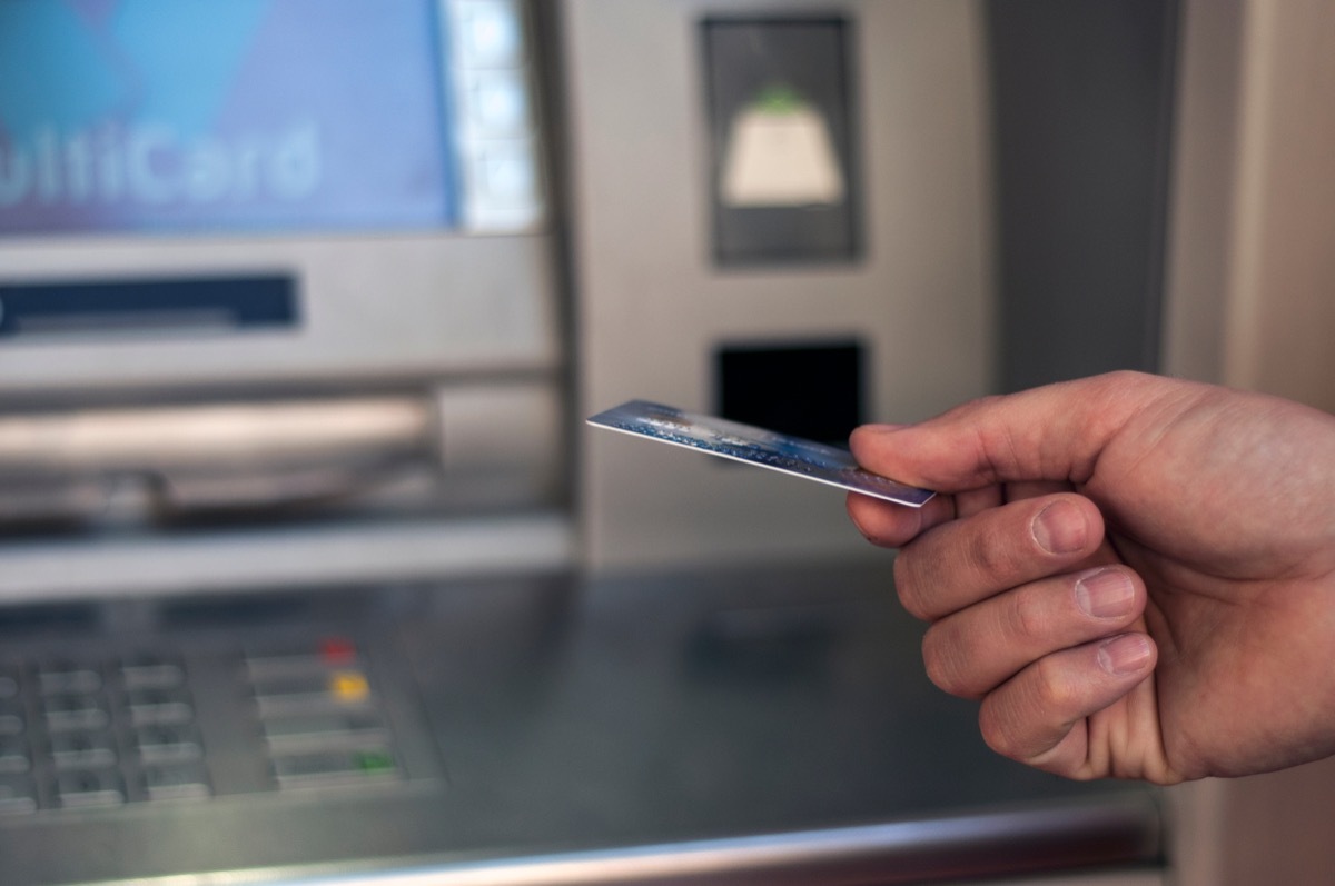 Person using atm machine 