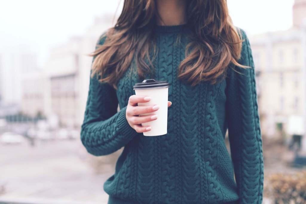 woman taking coffee to go stress stressed out, teeth