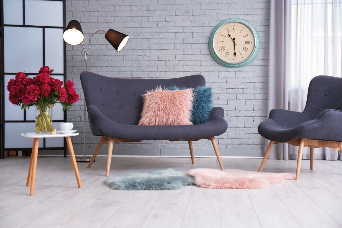 living room with layered shearling rugs