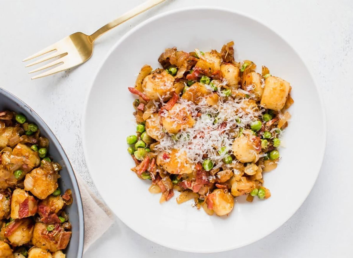 trader joes cauliflower gnocchi with peas onions turkey bacon on plate