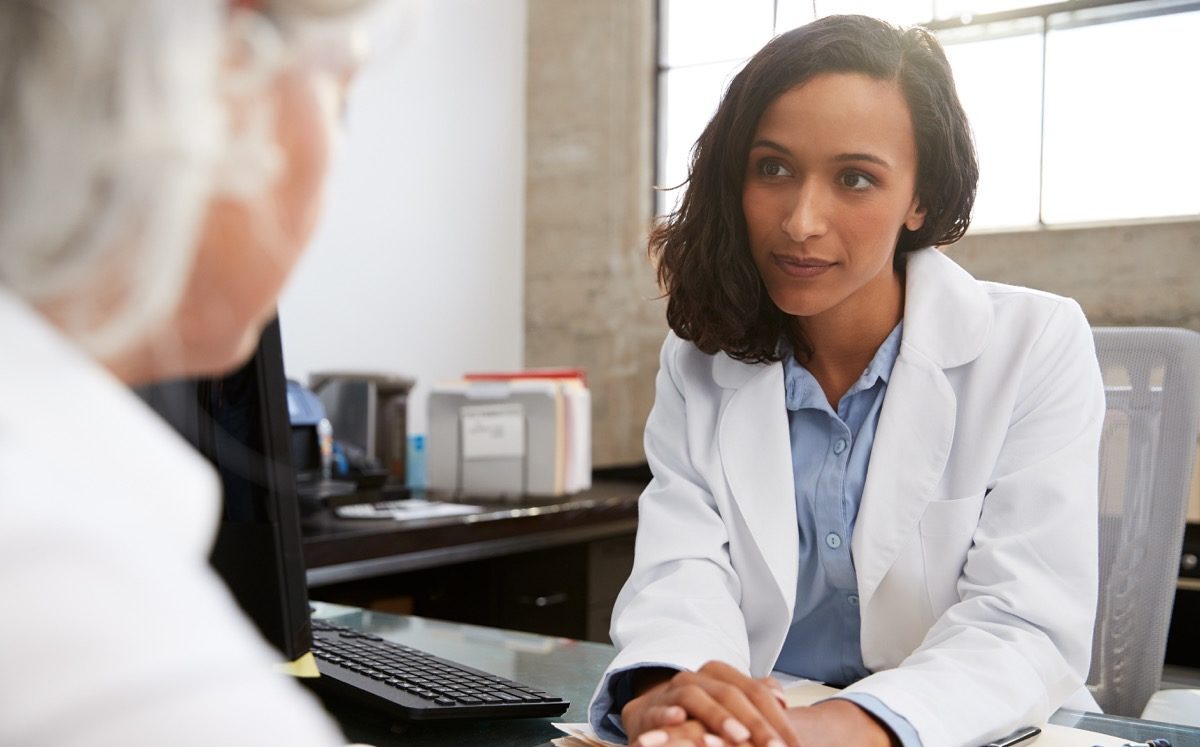 Doctor talking to woman with serious tone