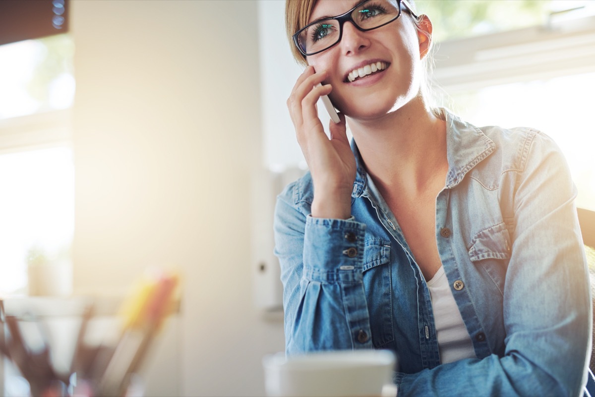 woman on phone smiling