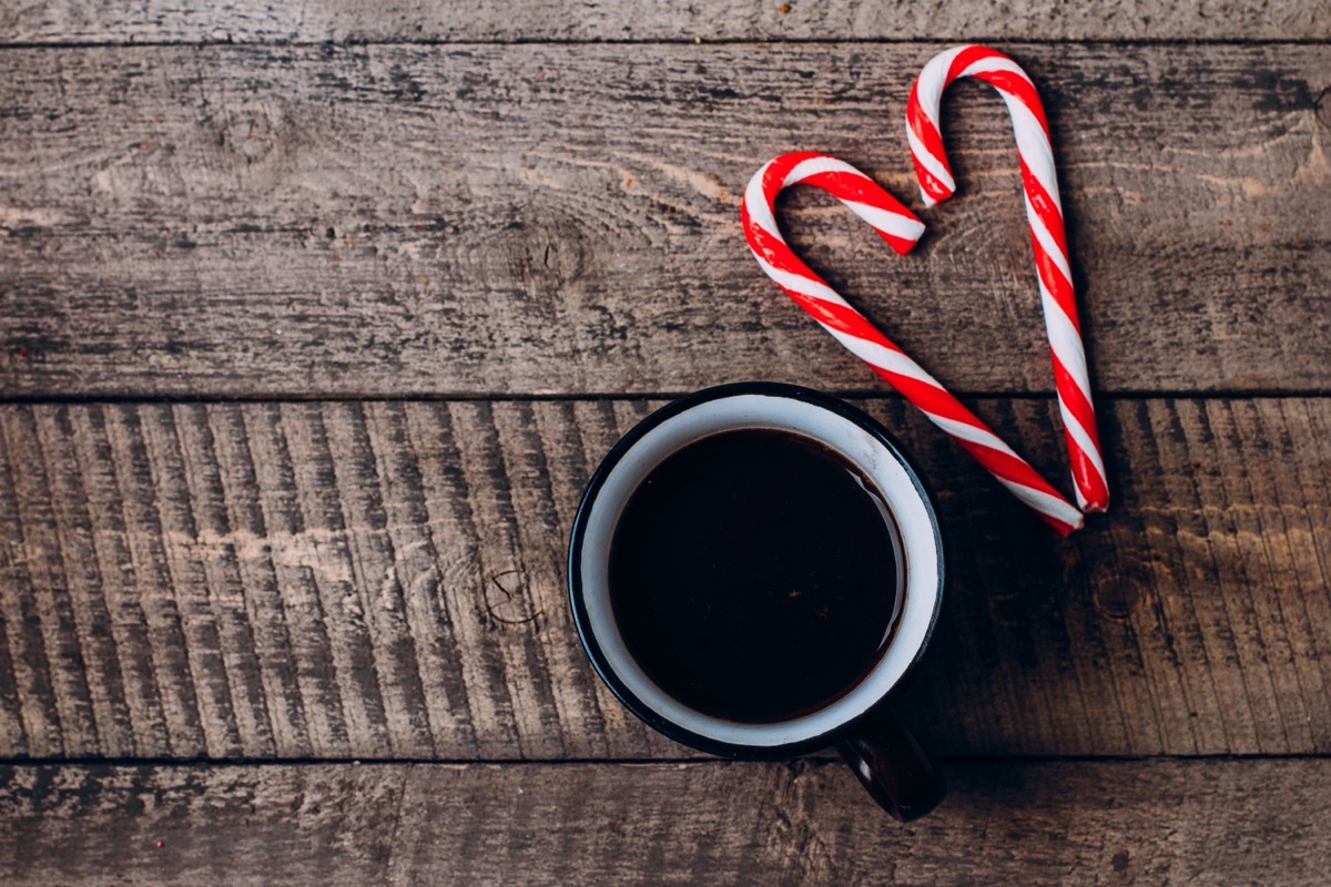 coffee and candy canes on wooden background