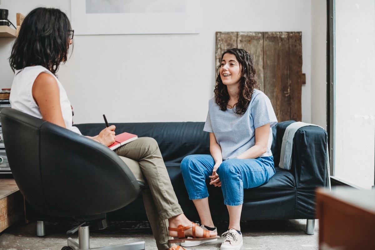 Psychotherapy session, woman talking to his psychologist in the studio