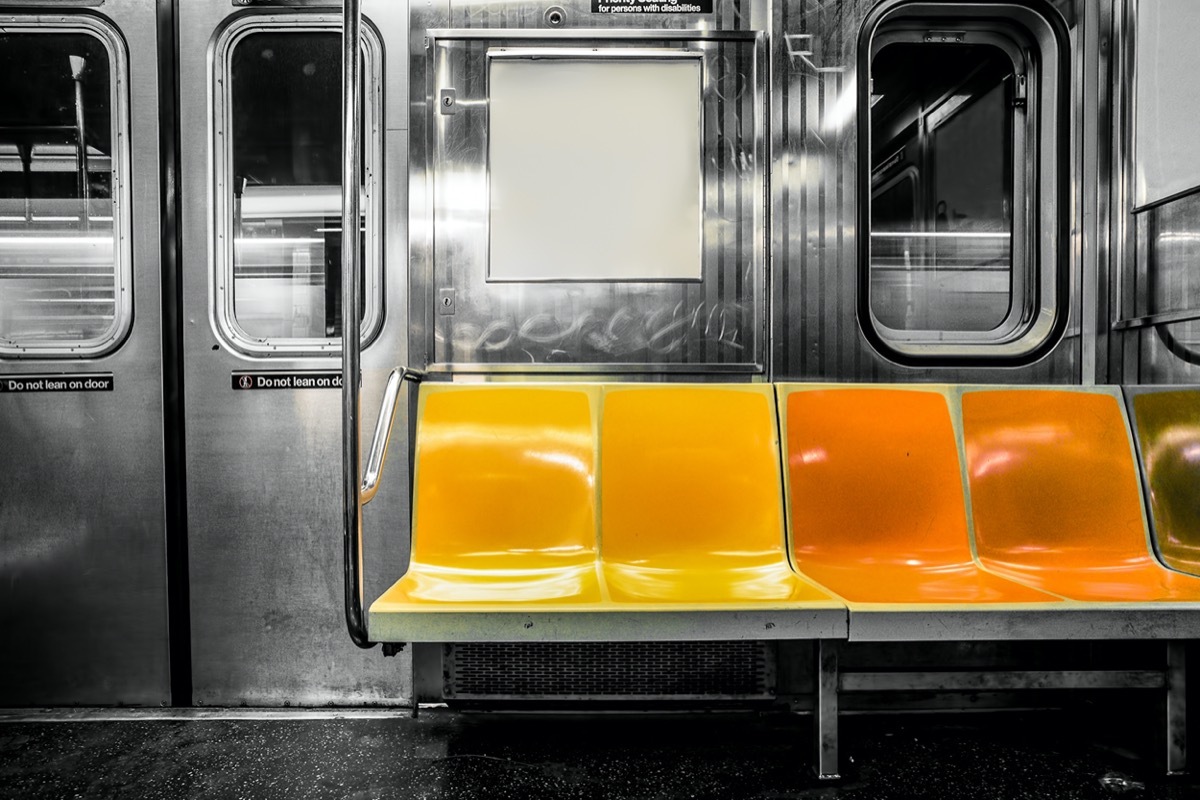 New York City subway car interior with colorful seats