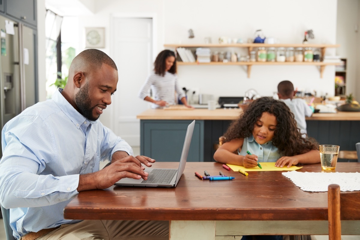 young family working in kitchen