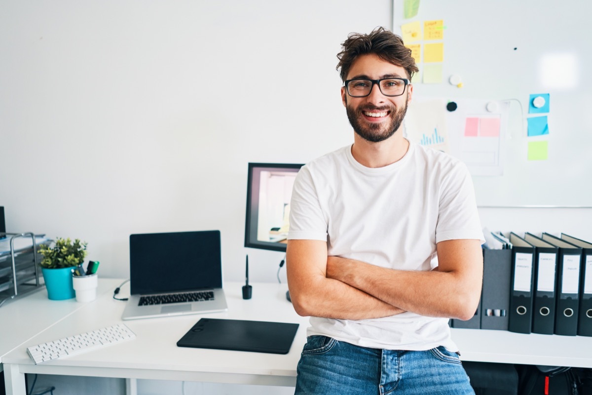 Smiling Man at His Desk