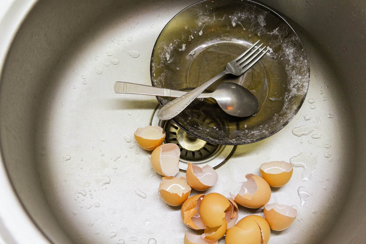 egg shells and bowl in sink