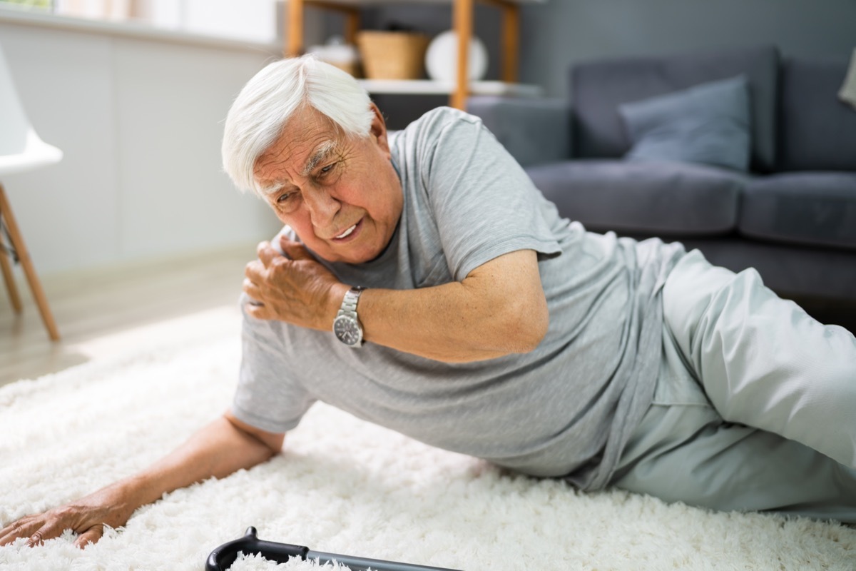 Senior man fall risk falling in living room