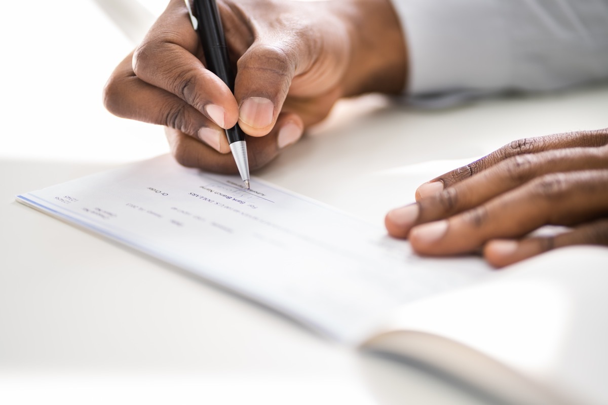 woman writing a check