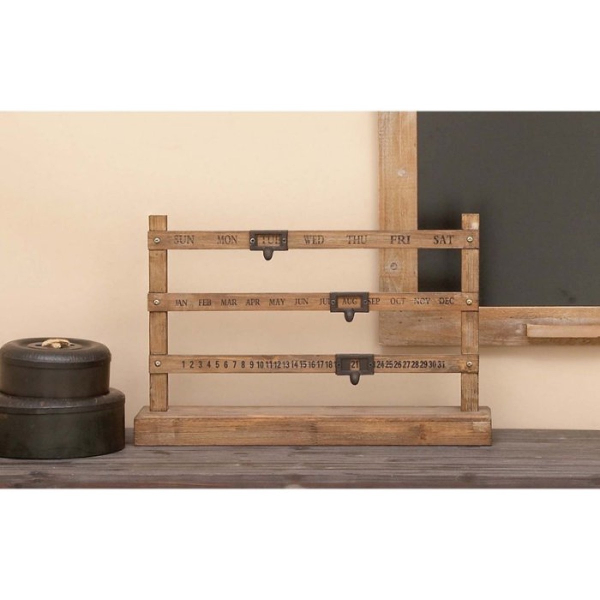 wooden rack on table in front of chalk board, rustic farmhouse decor