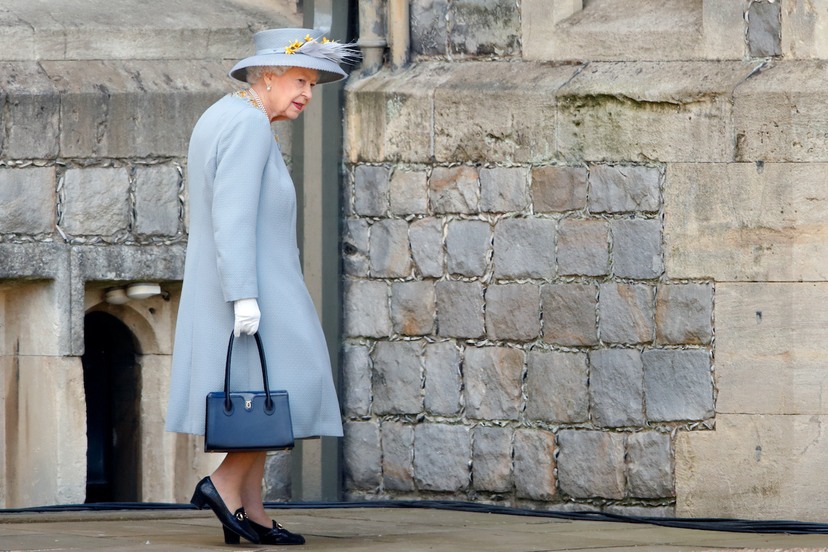 Queen Elizabeth II attends a military parade, held by the Household Division (during which The Queen's Colour of F Company Scots Guards will be trooped) in the Quadrangle of Windsor Castle, to mark her Official Birthday on June 12, 2021 in Windsor, England.