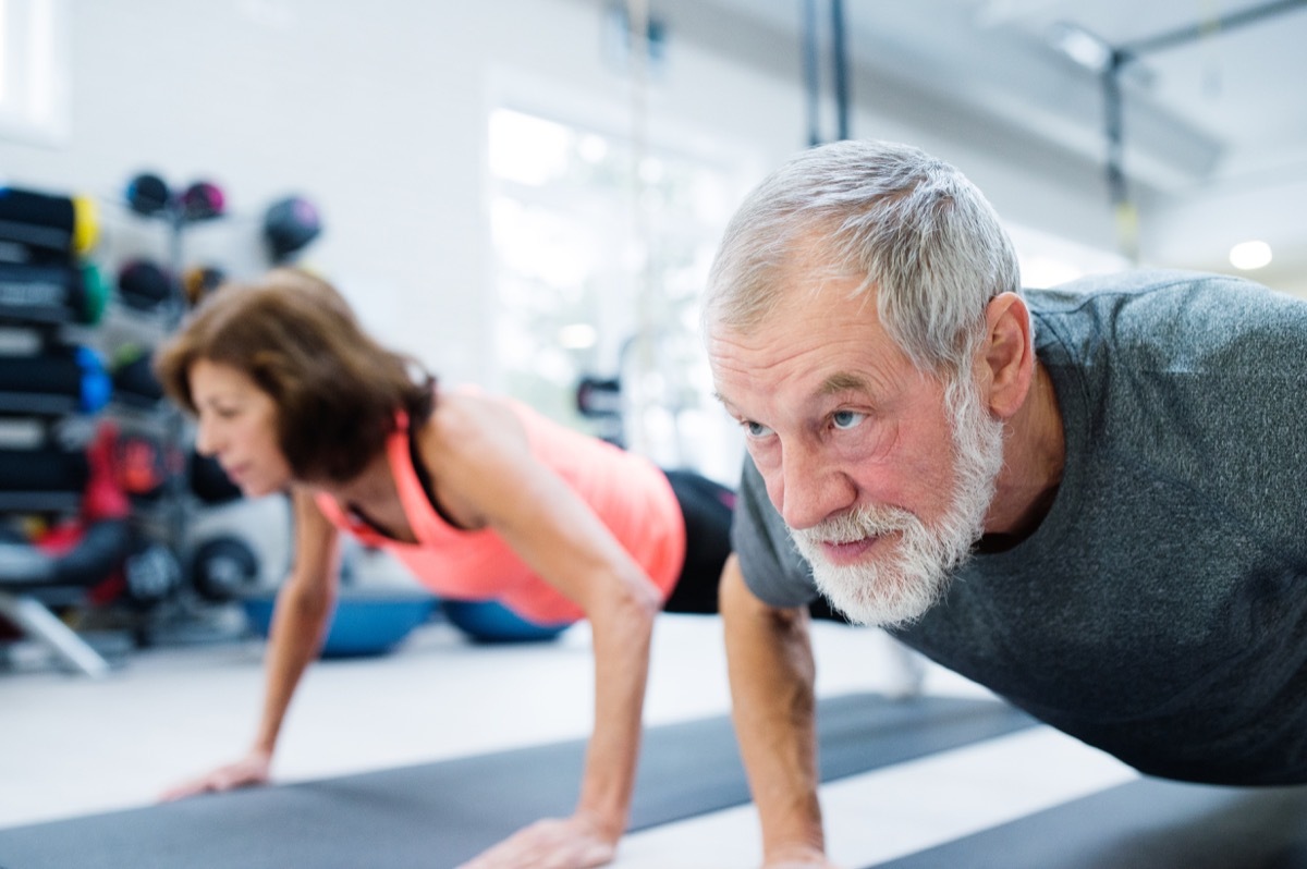 senior couple doing push ups