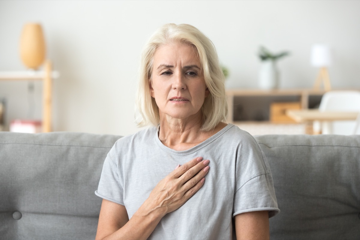 Woman Holding Her Chest