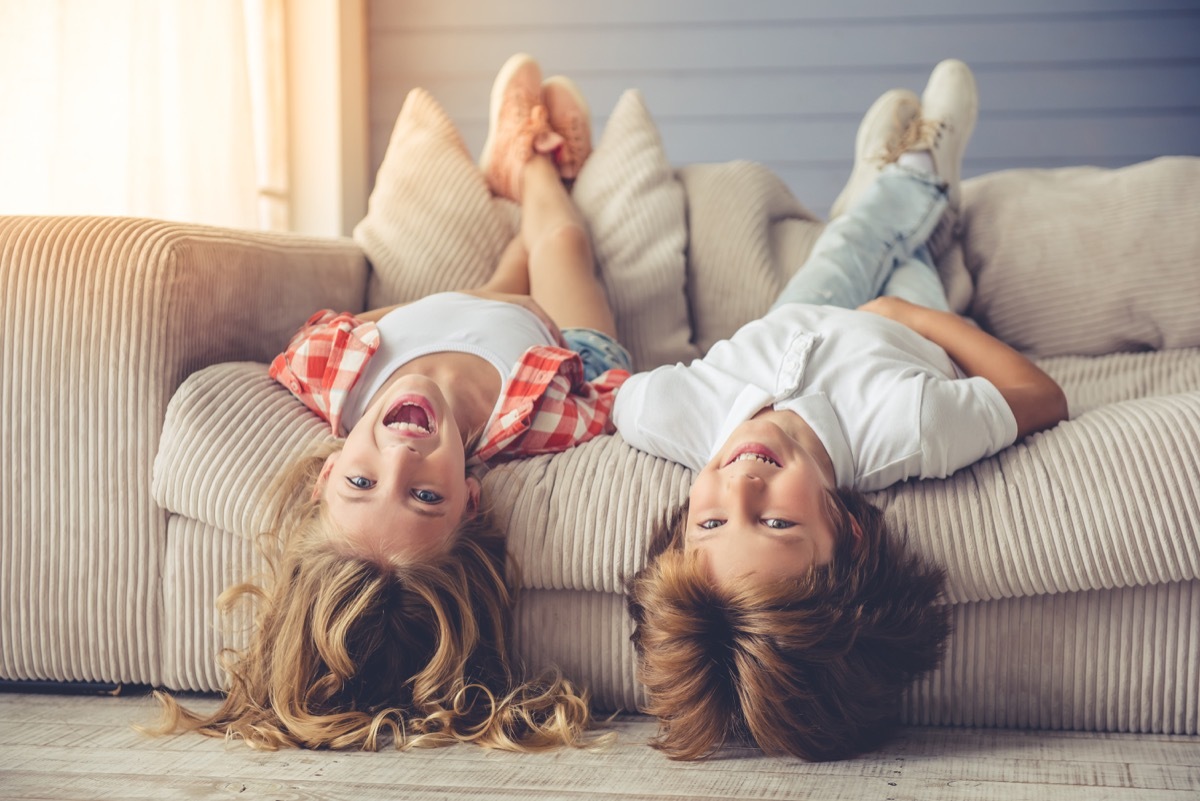 two siblings on couch