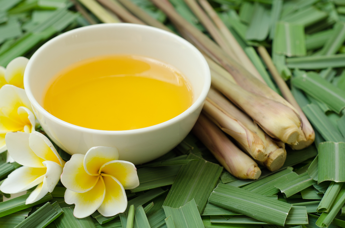 Citronella oil on citronella grass leave and lemongrass background