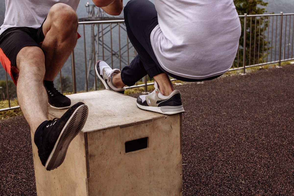 Two people doing pistol squats