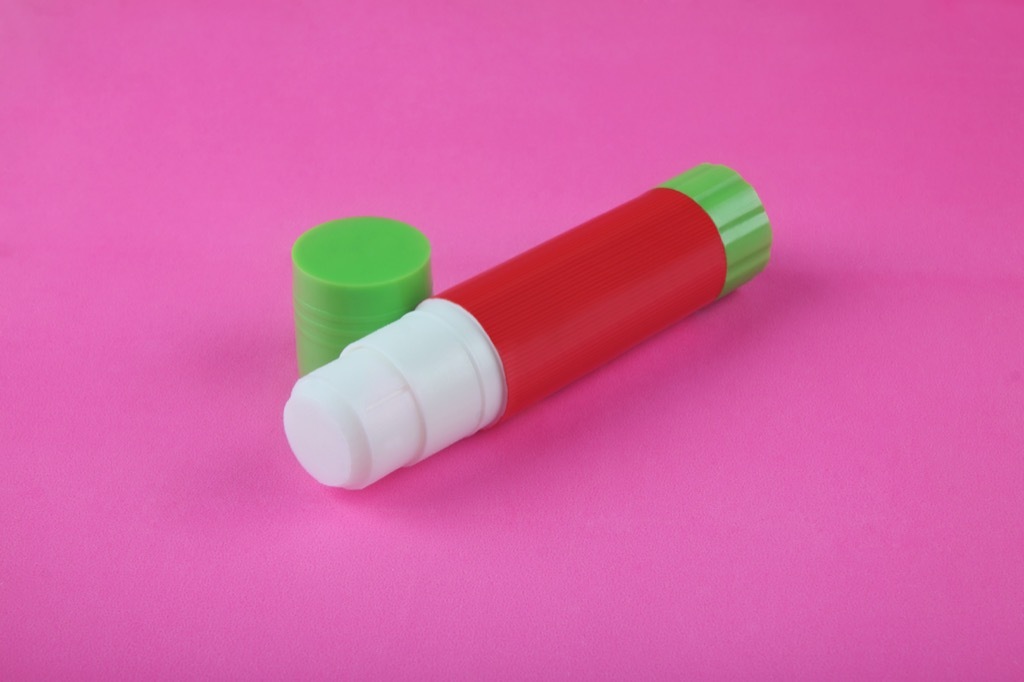 glue stick pink background