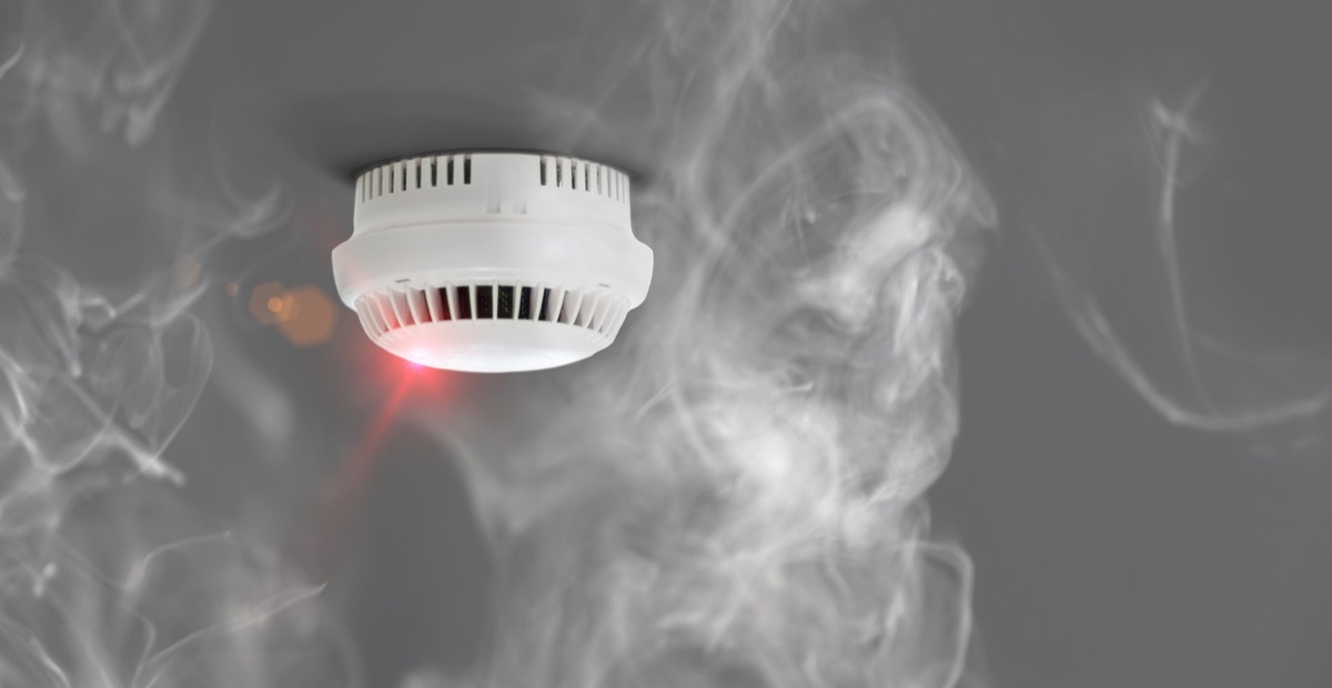 white smoke detector on ceiling