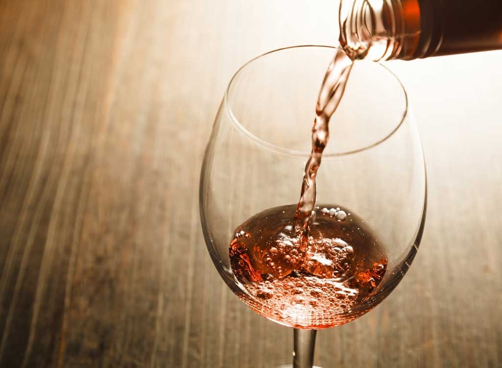 rose wine being poured into glass