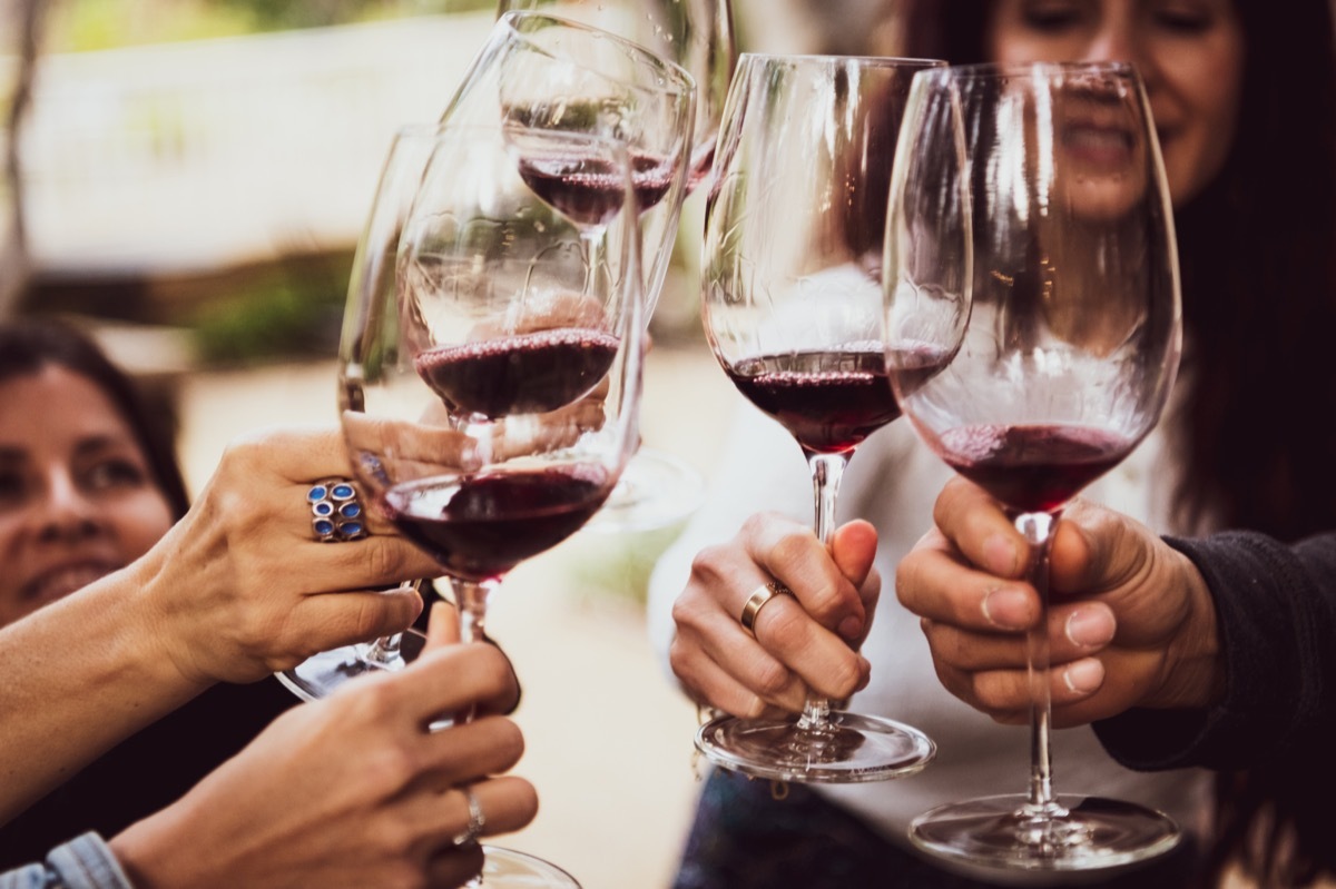 friends toasting glasses of red wine