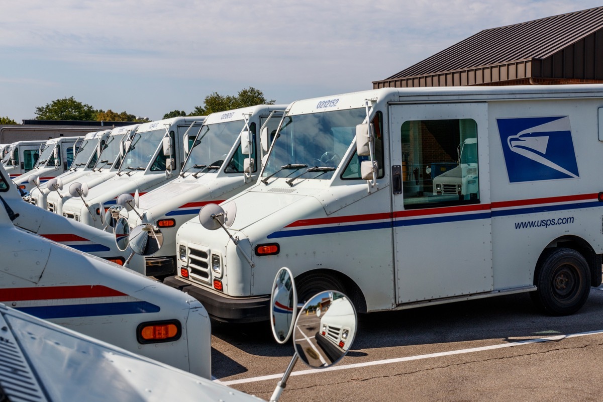 Circa August 2019: USPS Post Office Mail Trucks. The Post Office is responsible for providing mail delivery IX