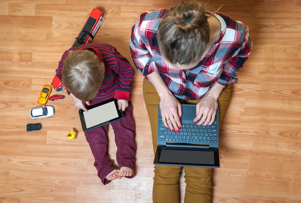 woman working from home with child, working mom