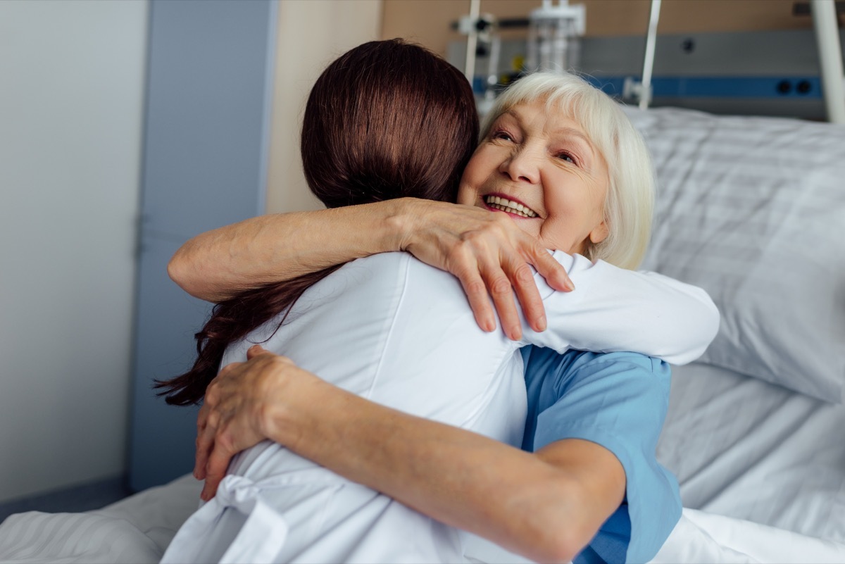 Woman hugging her doctor