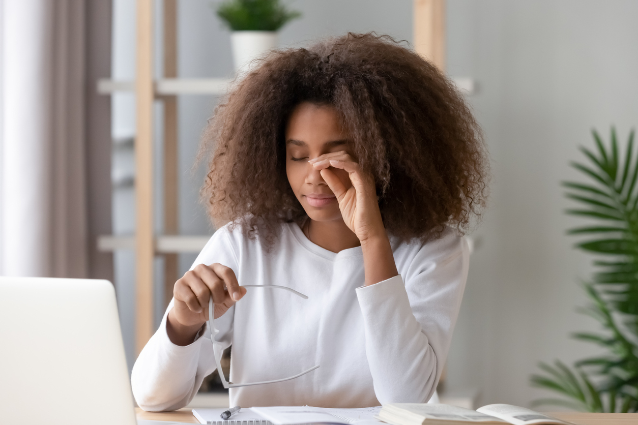 Woman rubbing her eye.