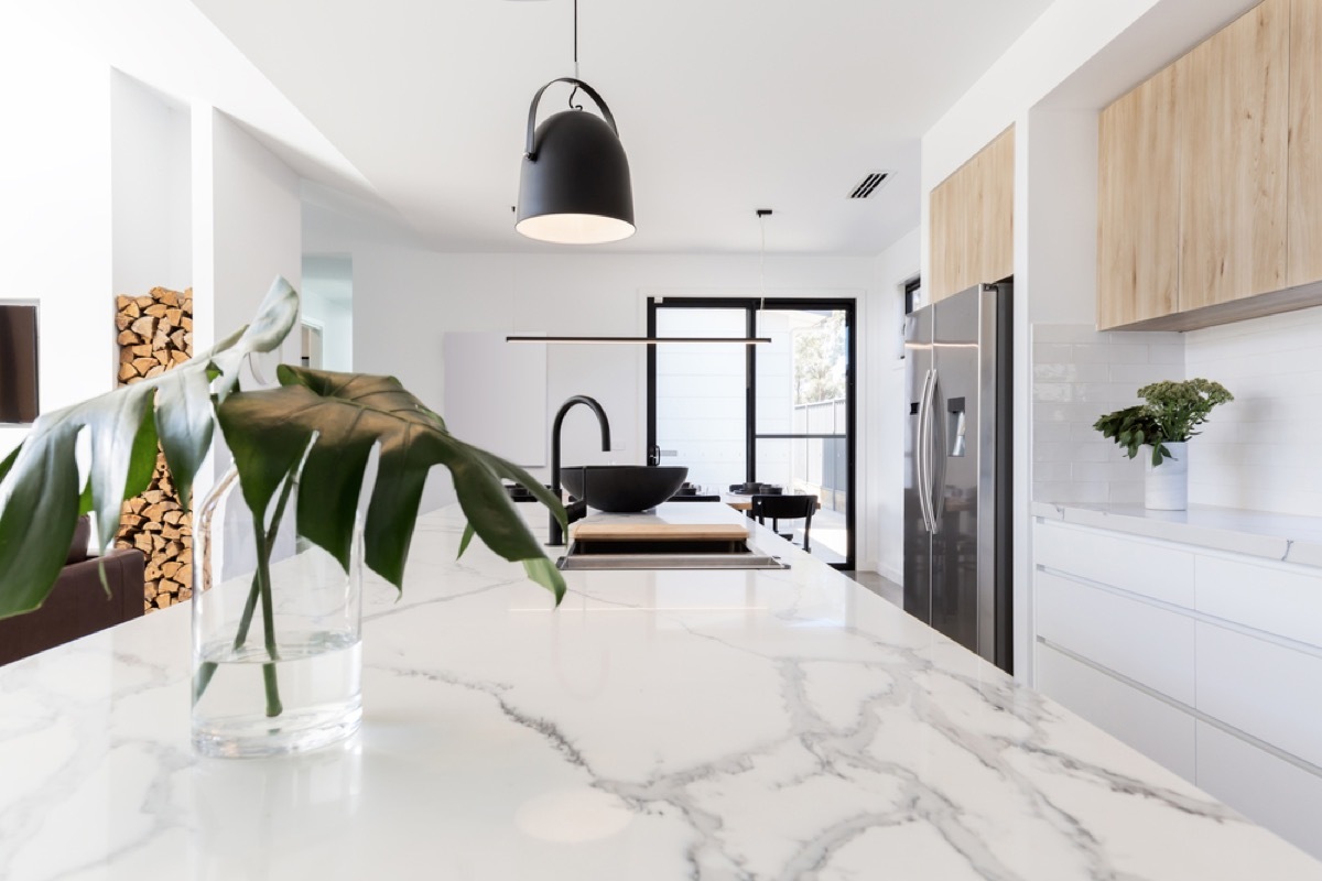 modern kitchen with white marble counters