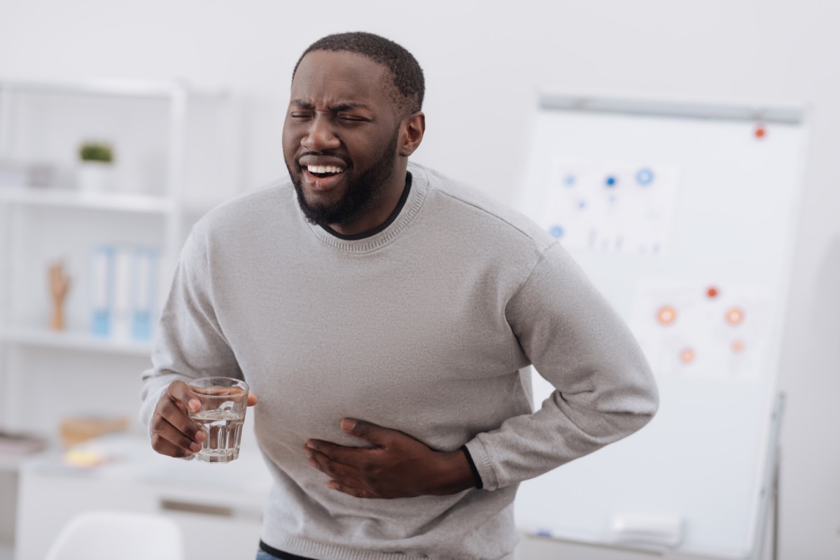 man holding a glass of water