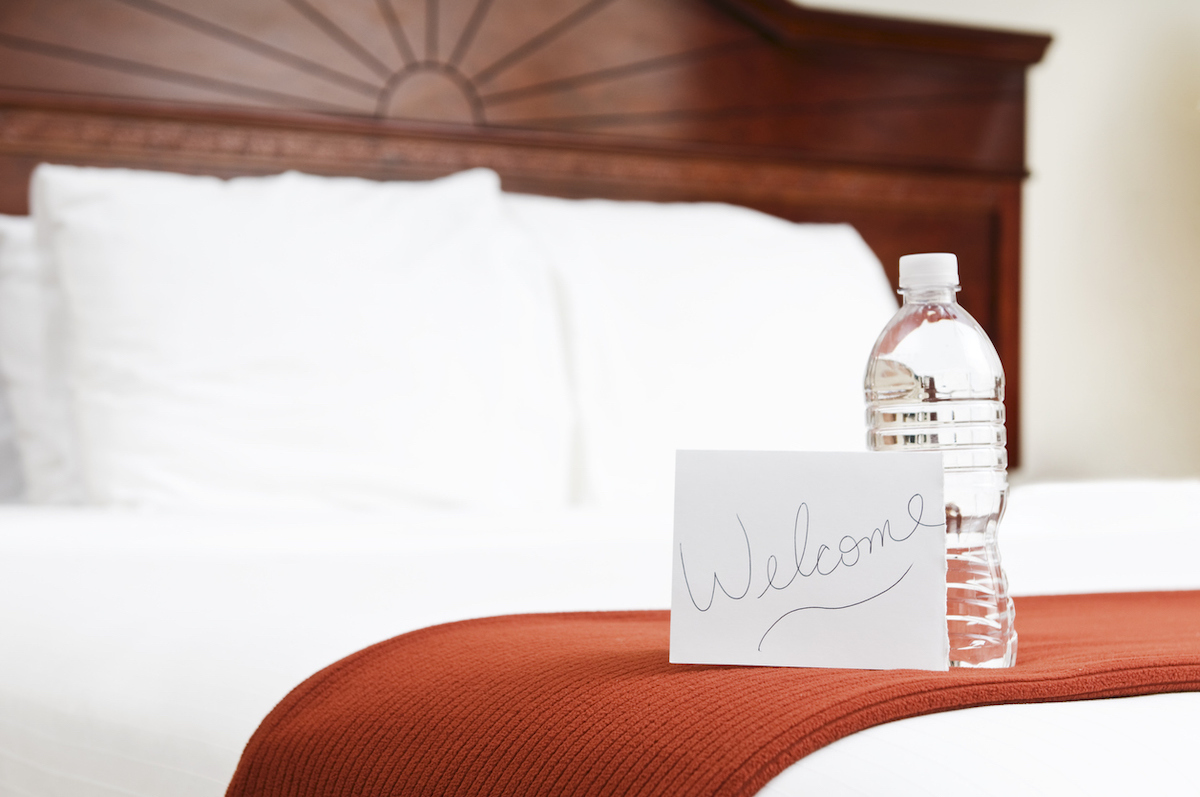 Hotel room with water as a welcome gift