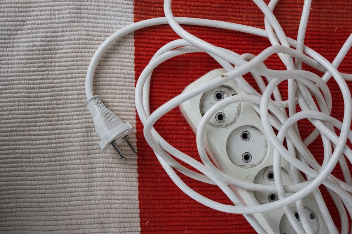 extension cord on red rug