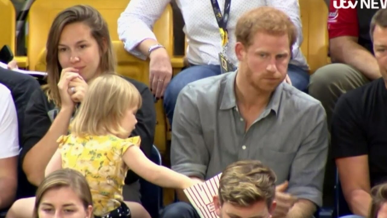 toddler stealing popcorn from prince harry